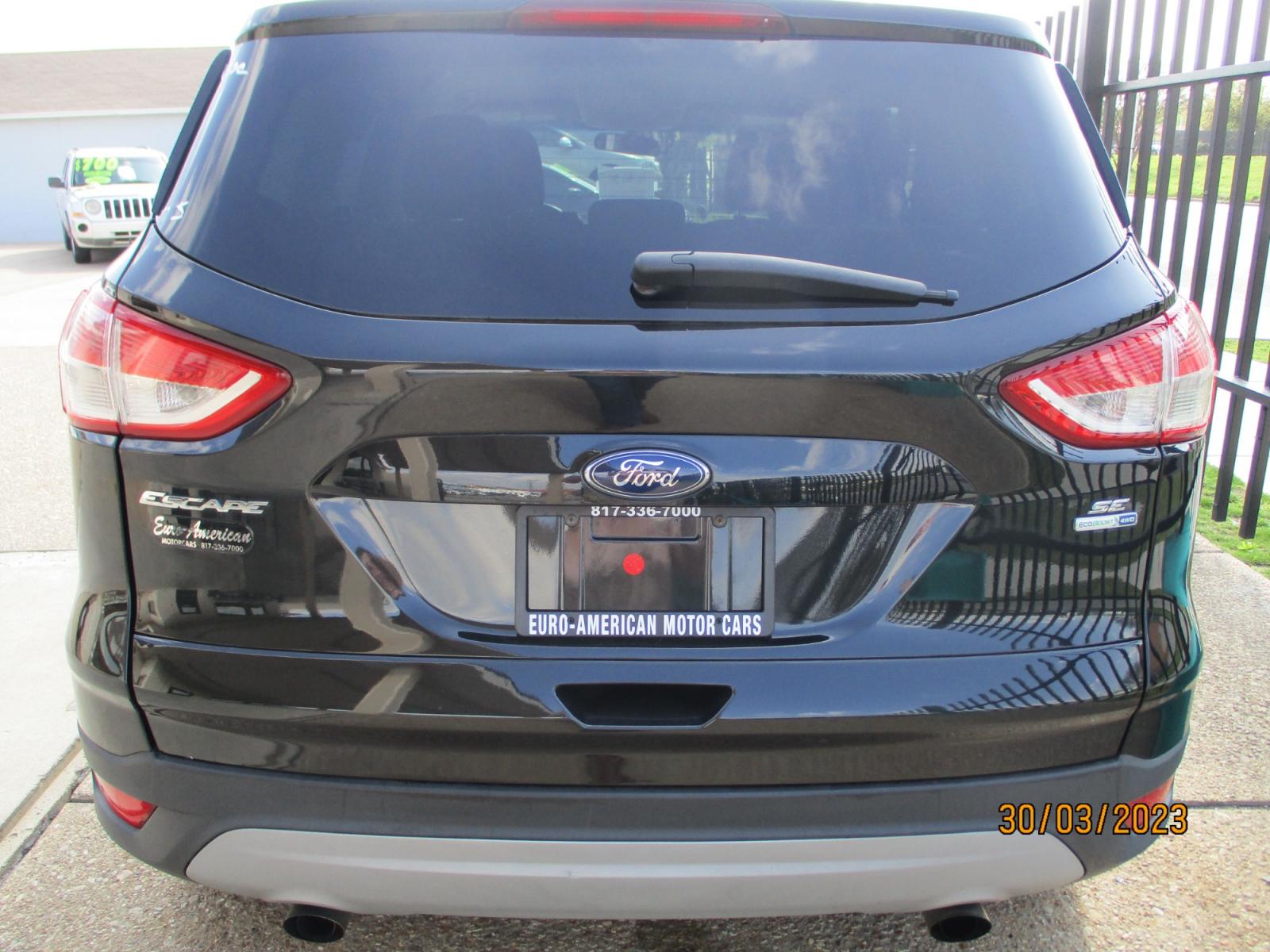 2013 Ford Escape SE AWD (1FMCU9GXXDU) with an 1.6L L4 DOHC 16V engine, 6-Speed Automatic transmission, located at 2001 E. Lancaster, Ft. Worth, 76103, (817) 336-7000, 32.746181, -97.301018 - Photo #6